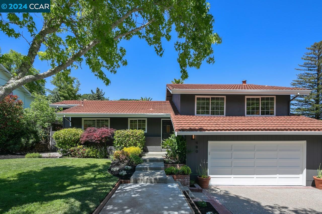 480 Blackstone Drive San Rafael, CA 94903 - Photo 1 of 1 a front view of a house with garden