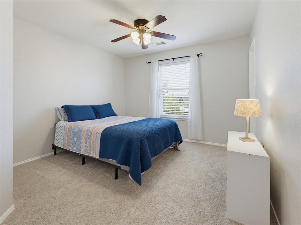 13268 Fencerow Road Fort Worth, TX 76244 - Photo 20 of 25 Carpeted interior room featuring a ceiling fan with light fixture, window with blinds and sheer curtains, and light neutral wall paint