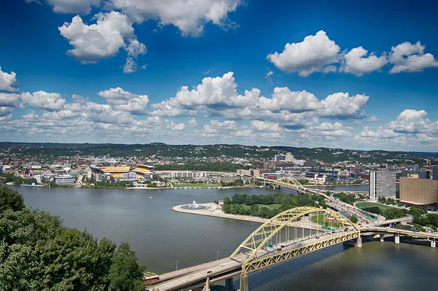 an aerial view of a city with lake view
