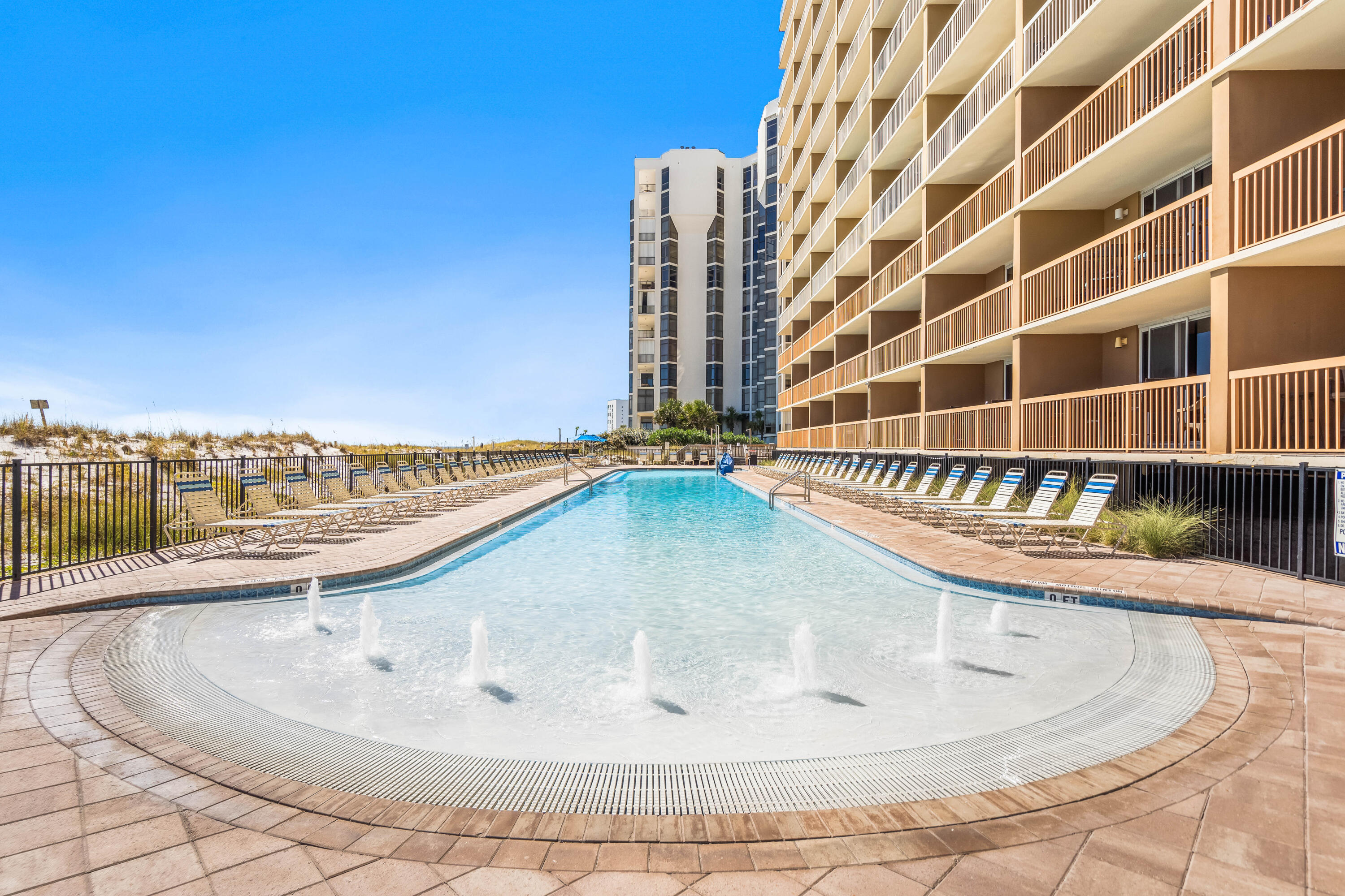 1002 Highway 98, Unit 415 Destin, FL 32541 - Photo 22 of 31 a view of a swimming pool with outdoor seating