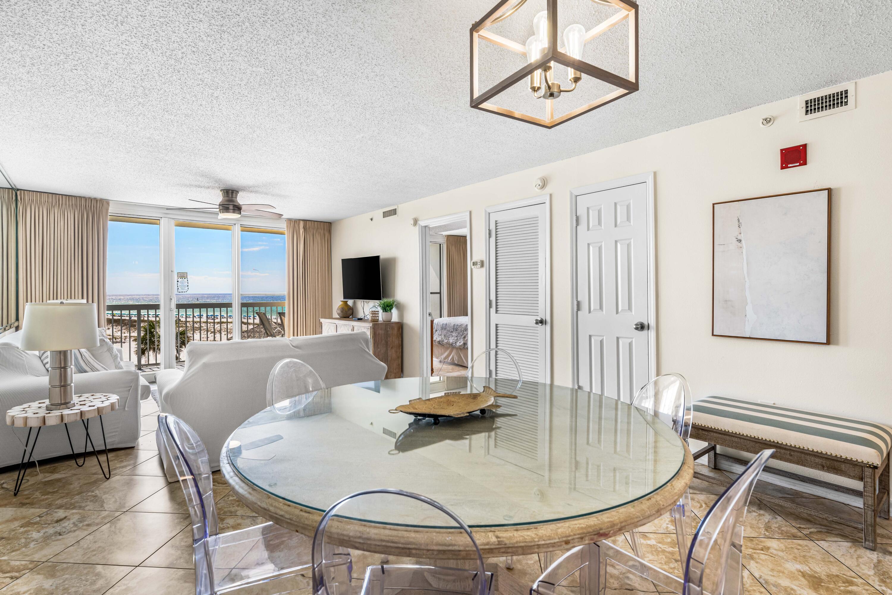 1002 Highway 98, Unit 415 Destin, FL 32541 - Photo 3 of 31 a living room with furniture and a chandelier