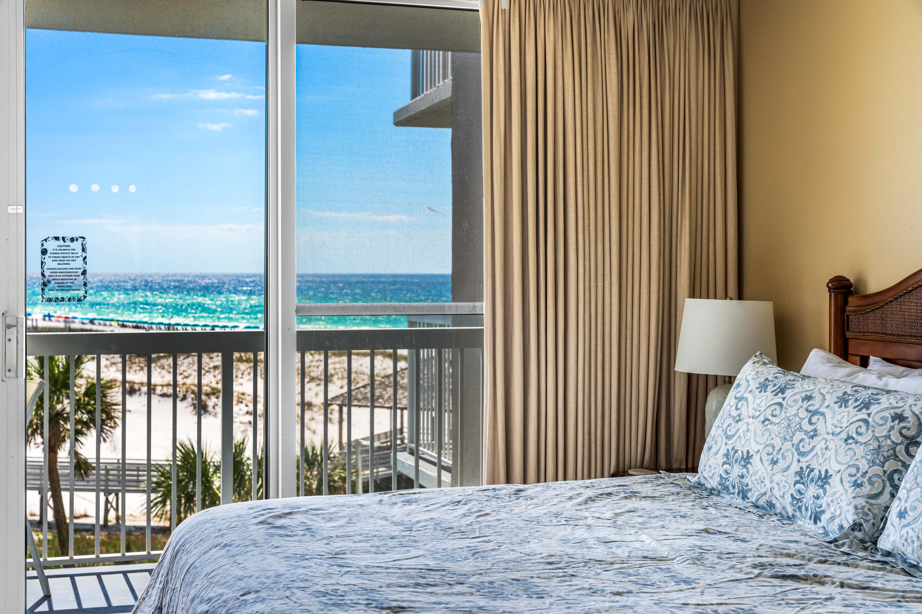 1002 Highway 98, Unit 415 Destin, FL 32541 - Photo 6 of 31 a bedroom with a bed and a window