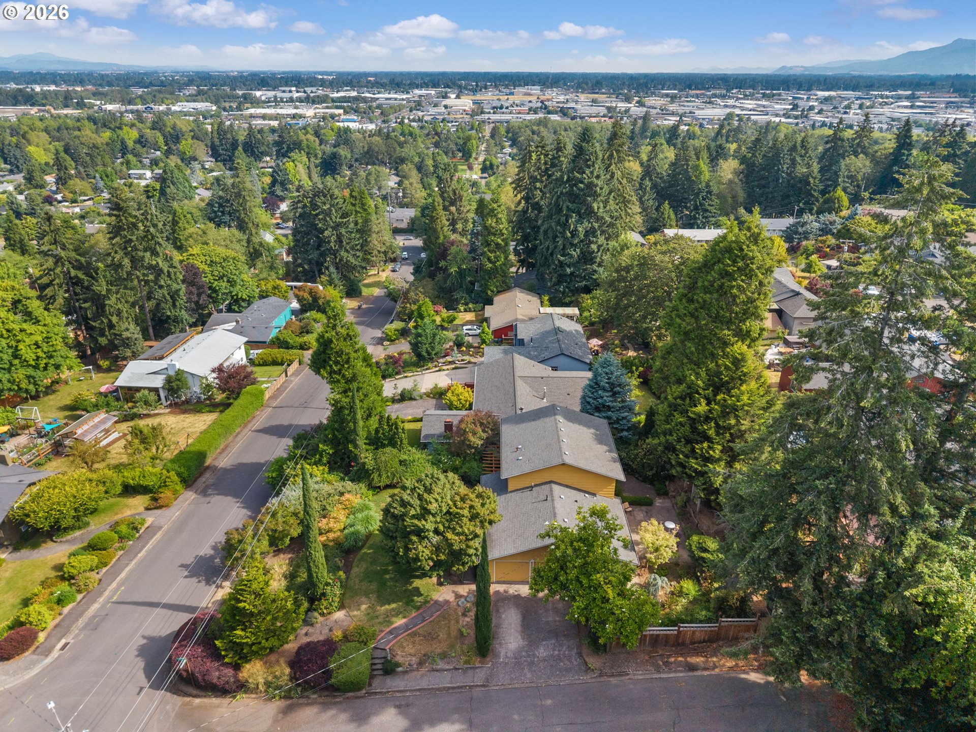 1995 Greiner Street Eugene, OR 97405 - Photo 37 of 39 an aerial view of a city with lots of residential buildings ocean and mountain view in back