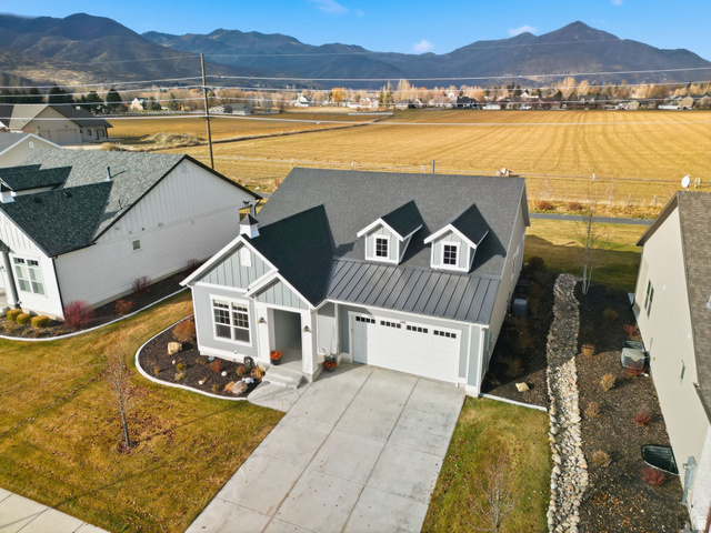 108 West Monte Rosa Lane Midway, UT 84049 - Photo 47 of 48 Contemporary home featuring a light gray exterior, a two-car garage, and a concrete driveway