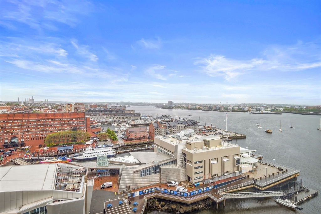85 East India Row, Unit 16H Boston, MA 02110 - Photo 18 of 20 a view of a city with tall buildings