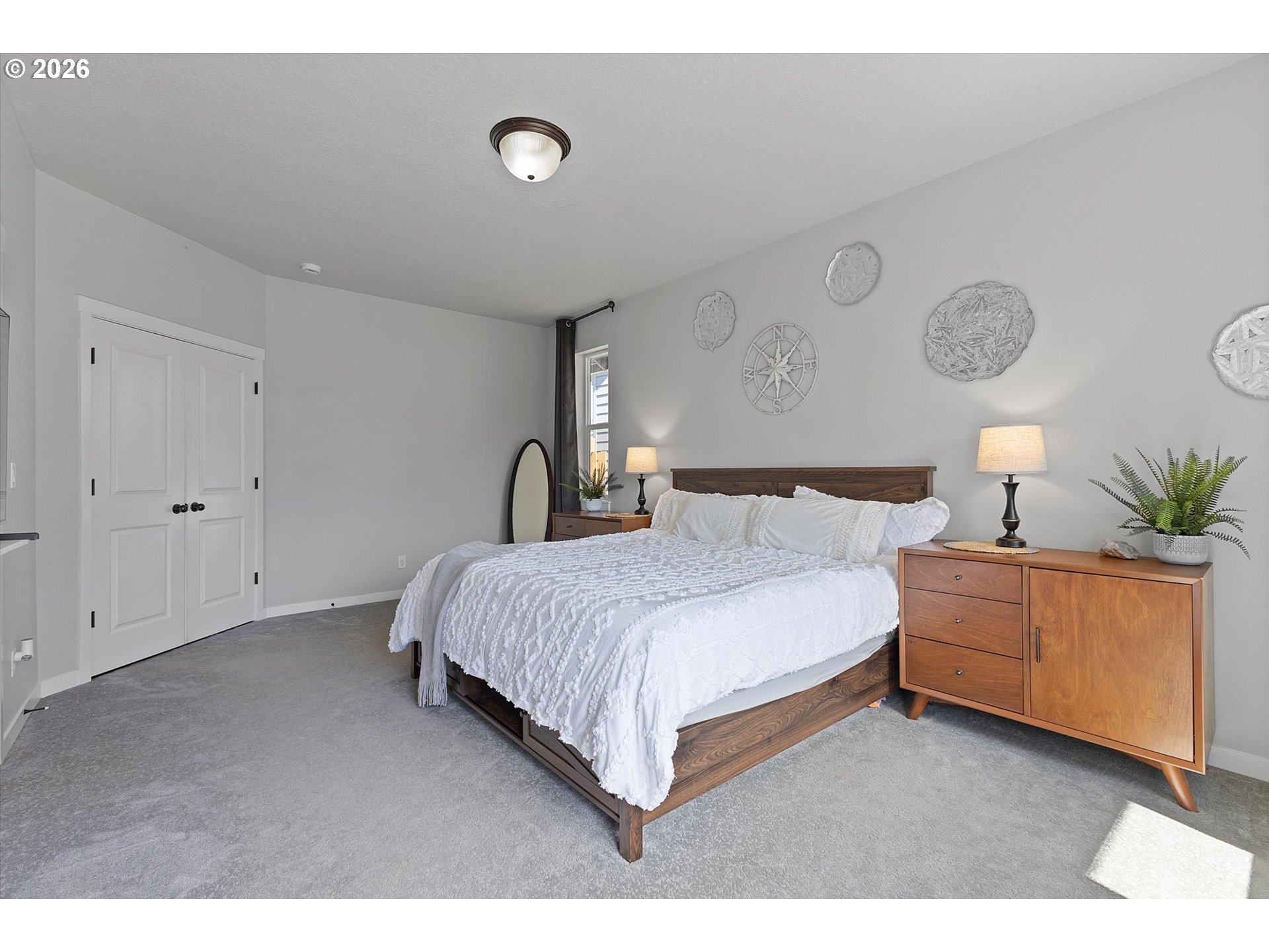 830 Southeast Darrow Road Estacada, OR 97023 - Photo 22 of 45 a bedroom with a bed and lamp