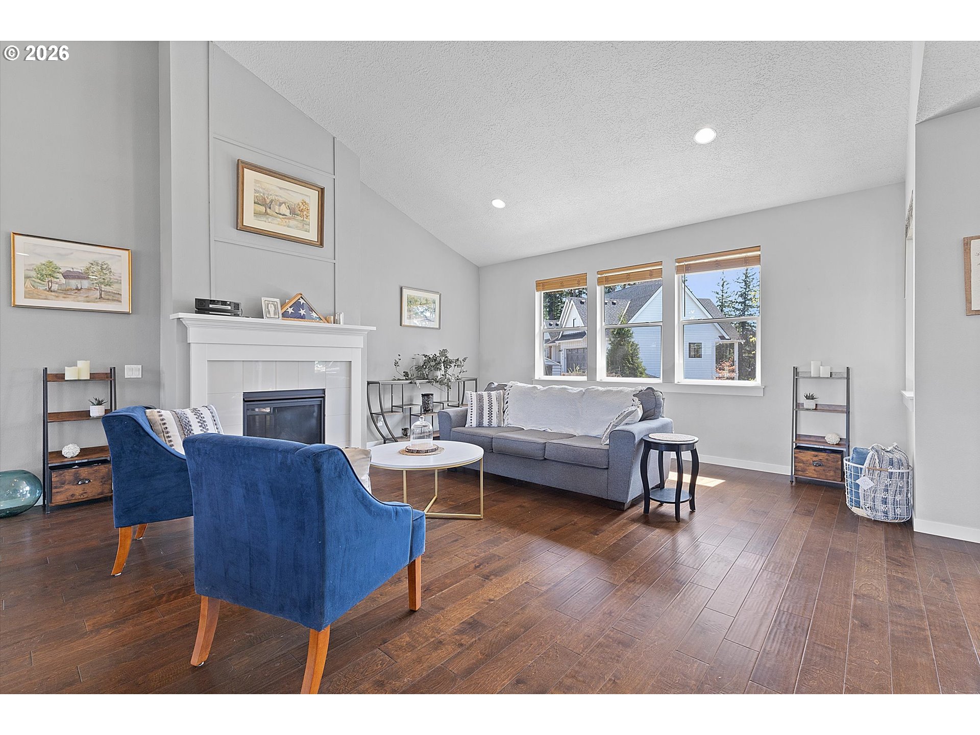 830 Southeast Darrow Road Estacada, OR 97023 - Photo 3 of 45 a living room with furniture a fireplace and a table
