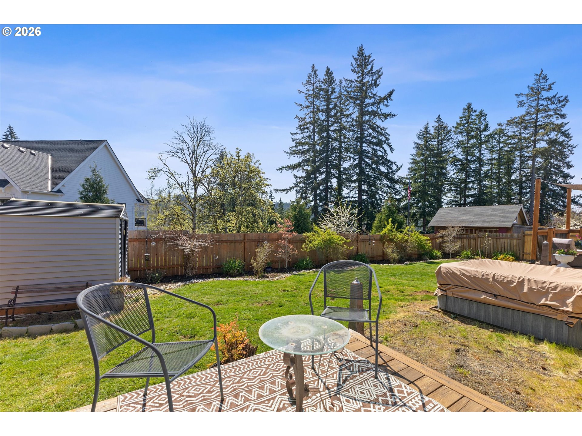 830 Southeast Darrow Road Estacada, OR 97023 - Photo 36 of 45 a view of a backyard with couches chair and fire pit