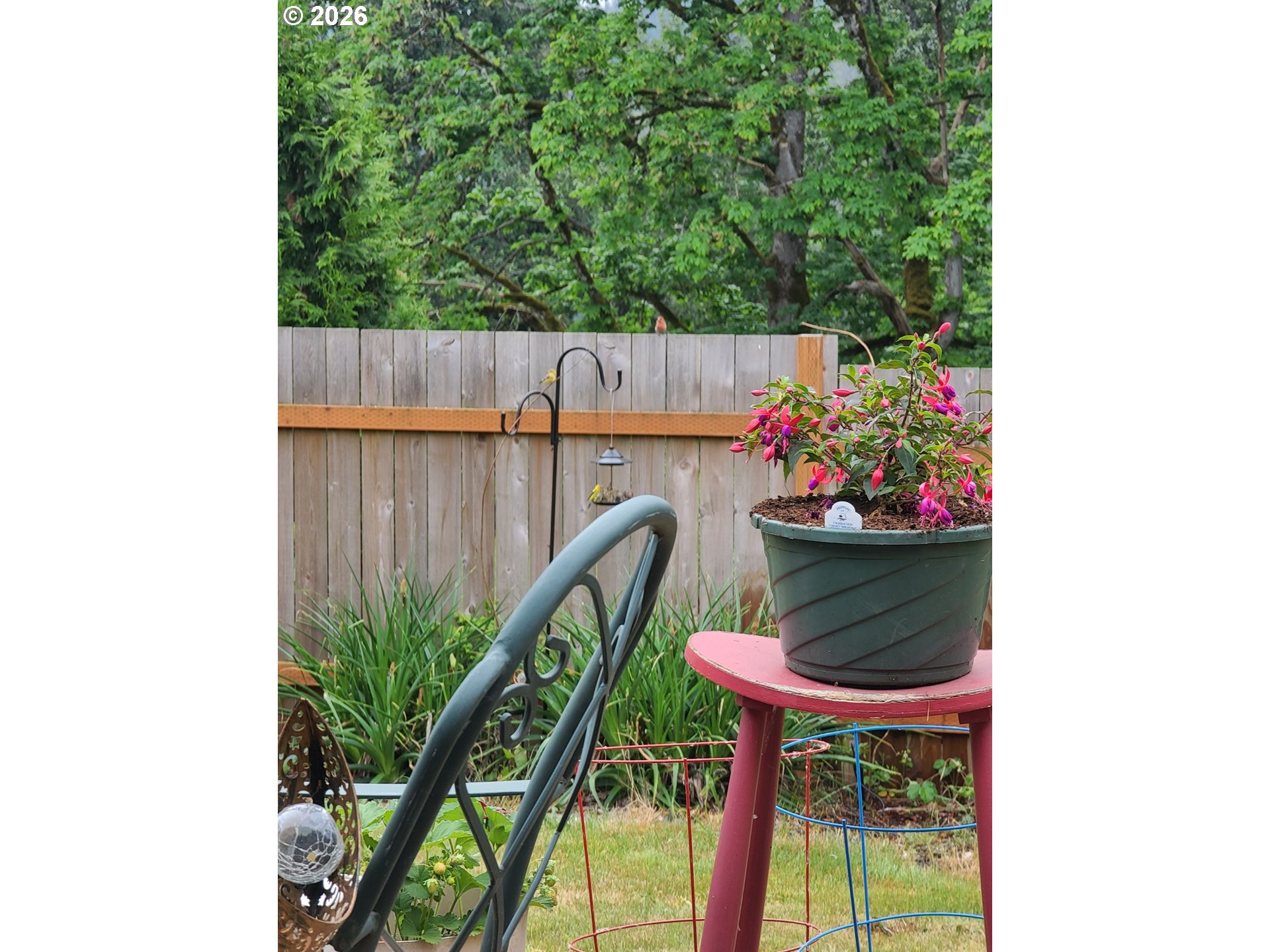 830 Southeast Darrow Road Estacada, OR 97023 - Photo 40 of 45 a table and chairs in a patio with potted plants