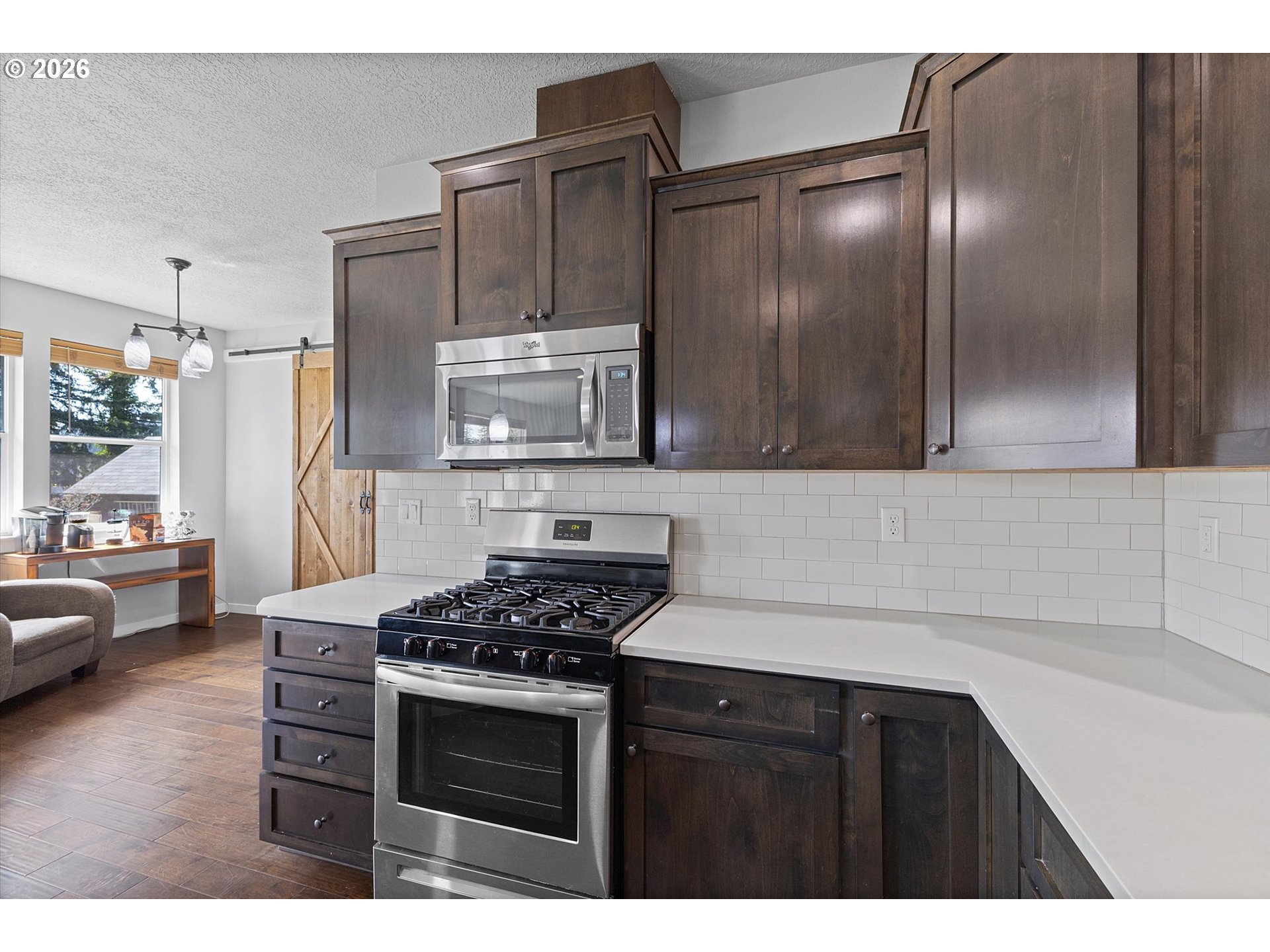 830 Southeast Darrow Road Estacada, OR 97023 - Photo 10 of 45 a kitchen with stainless steel appliances a stove and a refrigerator
