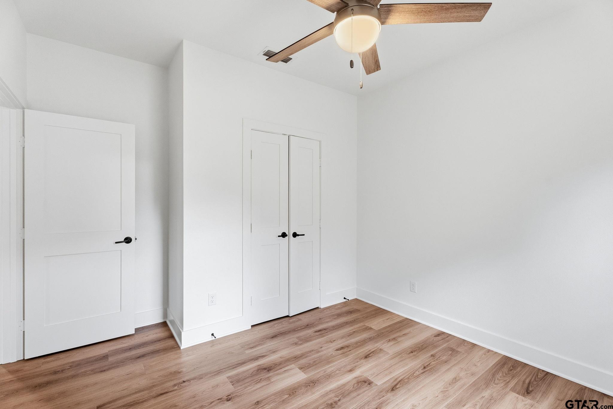 2968 Calloway Road Tyler, TX 75701 - Photo 17 of 24 a view of a room with wooden floor