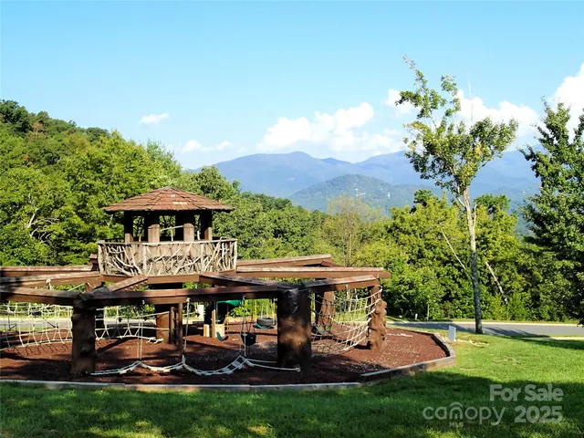 a view of a patio with table and chairs under an umbrella