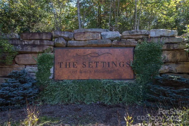 a sign on the side of the road