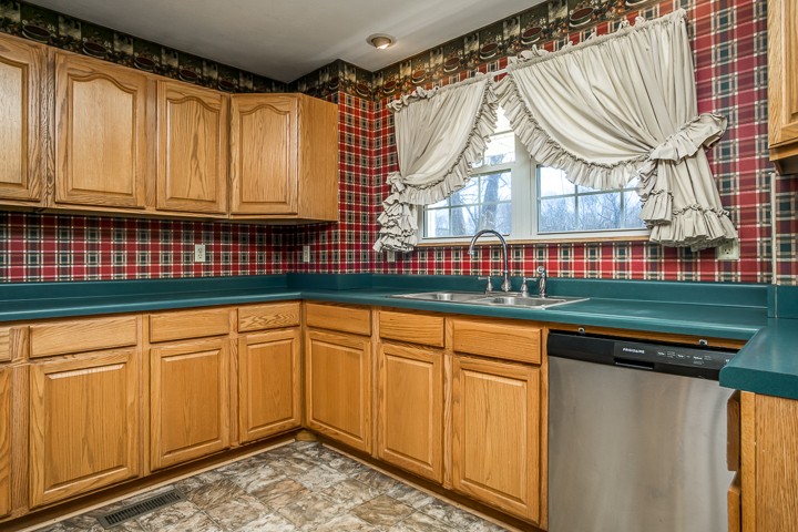 391 Oakley Allons Road Allons, TN 38541 - Photo 11 of 35 a kitchen with stainless steel appliances granite countertop a sink and a cabinets