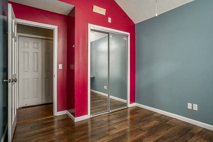 391 Oakley Allons Road Allons, TN 38541 - Photo 17 of 35 an empty room with wooden floor and closet