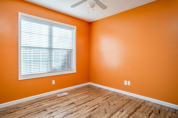 391 Oakley Allons Road Allons, TN 38541 - Photo 20 of 35 a view of an empty room with a window and wooden floor