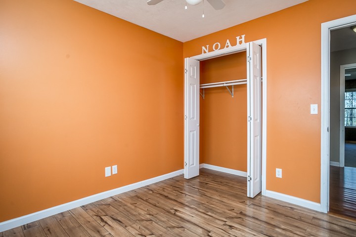 391 Oakley Allons Road Allons, TN 38541 - Photo 21 of 35 a view of an empty room with wooden floor and a window