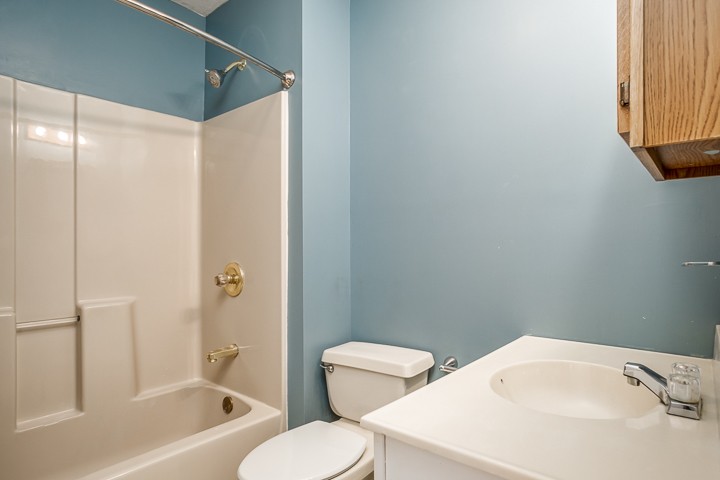 391 Oakley Allons Road Allons, TN 38541 - Photo 22 of 35 a white toilet sitting next to a bathroom sink and tub