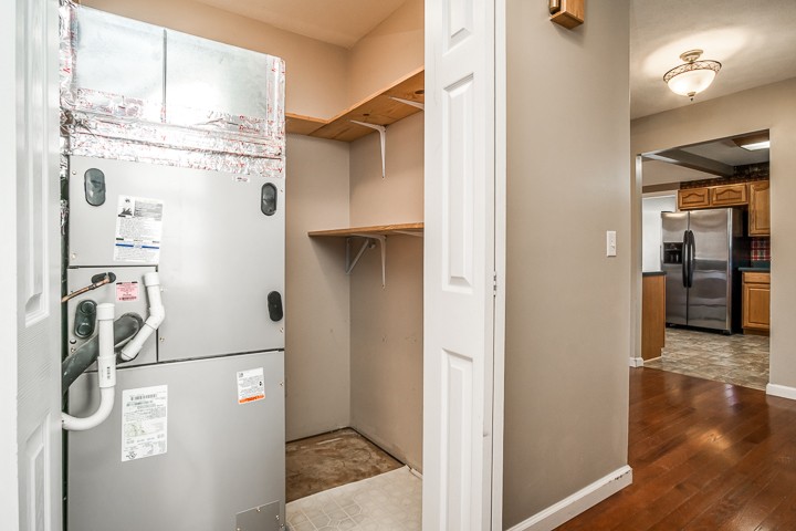391 Oakley Allons Road Allons, TN 38541 - Photo 25 of 35 a view of a kitchen with refrigerator and wooden floor