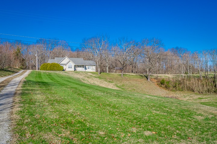 391 Oakley Allons Road Allons, TN 38541 - Photo 33 of 35 a view of a garden with a building in the background
