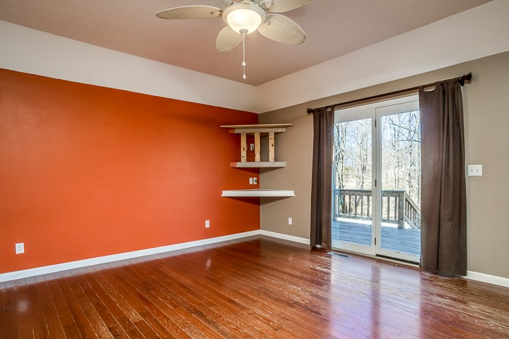 391 Oakley Allons Road Allons, TN 38541 - Photo 6 of 35 wooden floor in an empty room with a window
