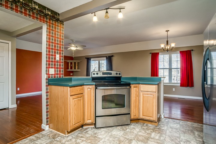 391 Oakley Allons Road Allons, TN 38541 - Photo 7 of 35 a kitchen with stainless steel appliances granite countertop a stove and a refrigerator