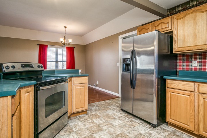 391 Oakley Allons Road Allons, TN 38541 - Photo 10 of 35 a kitchen with stainless steel appliances granite countertop a refrigerator a stove and a sink