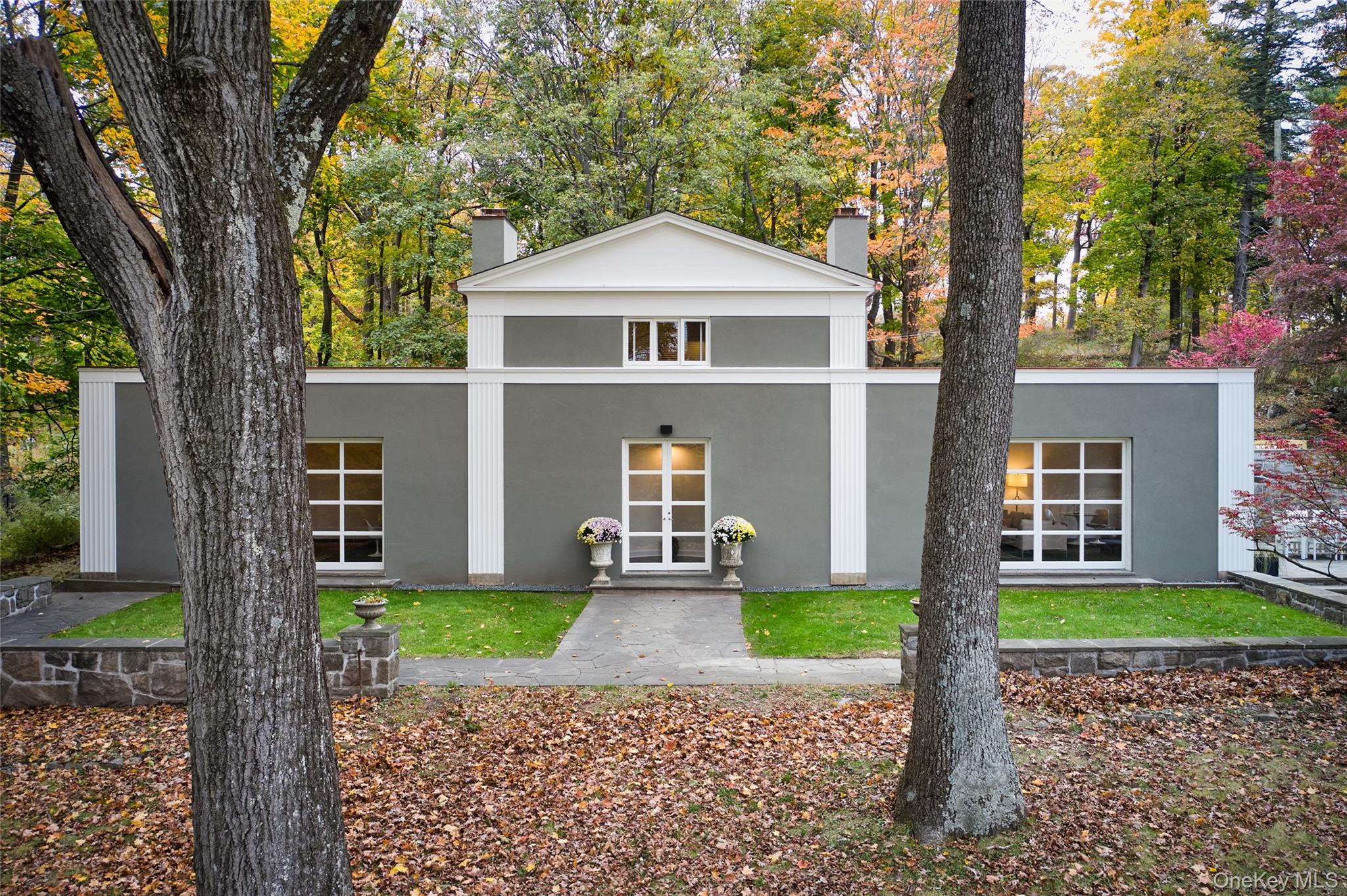 72 Lookout Road Tuxedo Park, NY 10987 - Photo 1 of 49 a front view of a house with a yard and garage