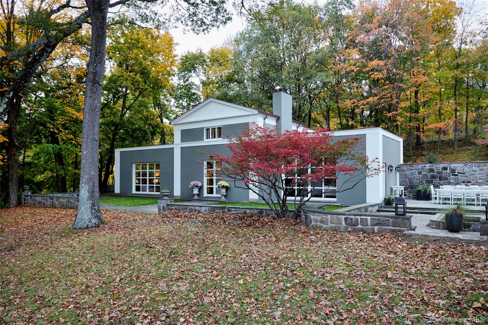 72 Lookout Road Tuxedo Park, NY 10987 - Photo 2 of 49 a front view of a house with garden