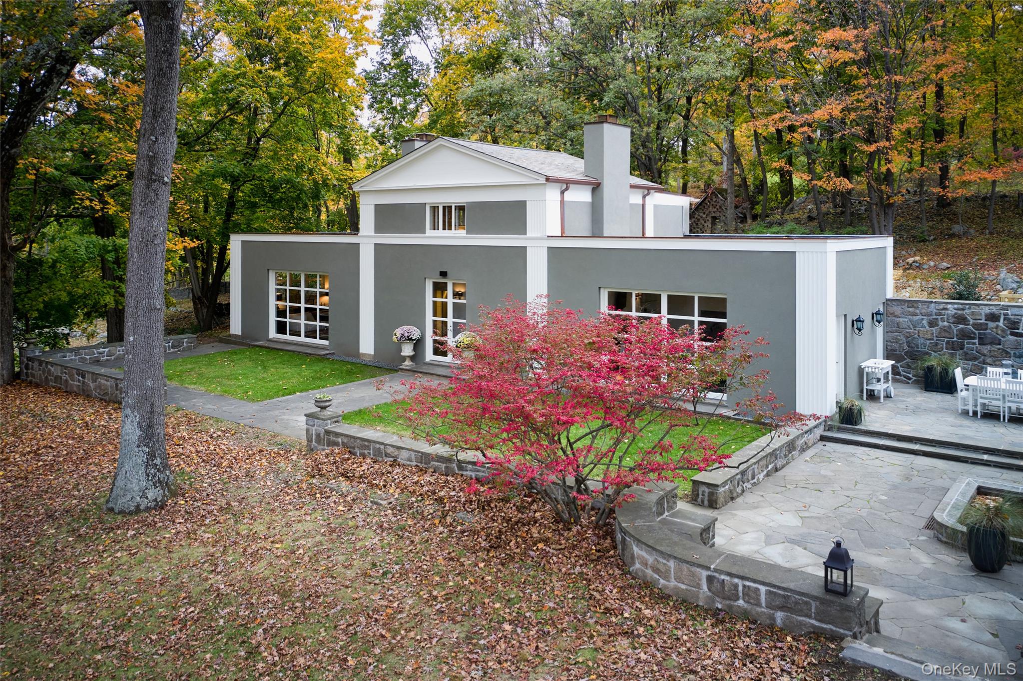 72 Lookout Road Tuxedo Park, NY 10987 - Photo 46 of 49 a front view of a house with garden