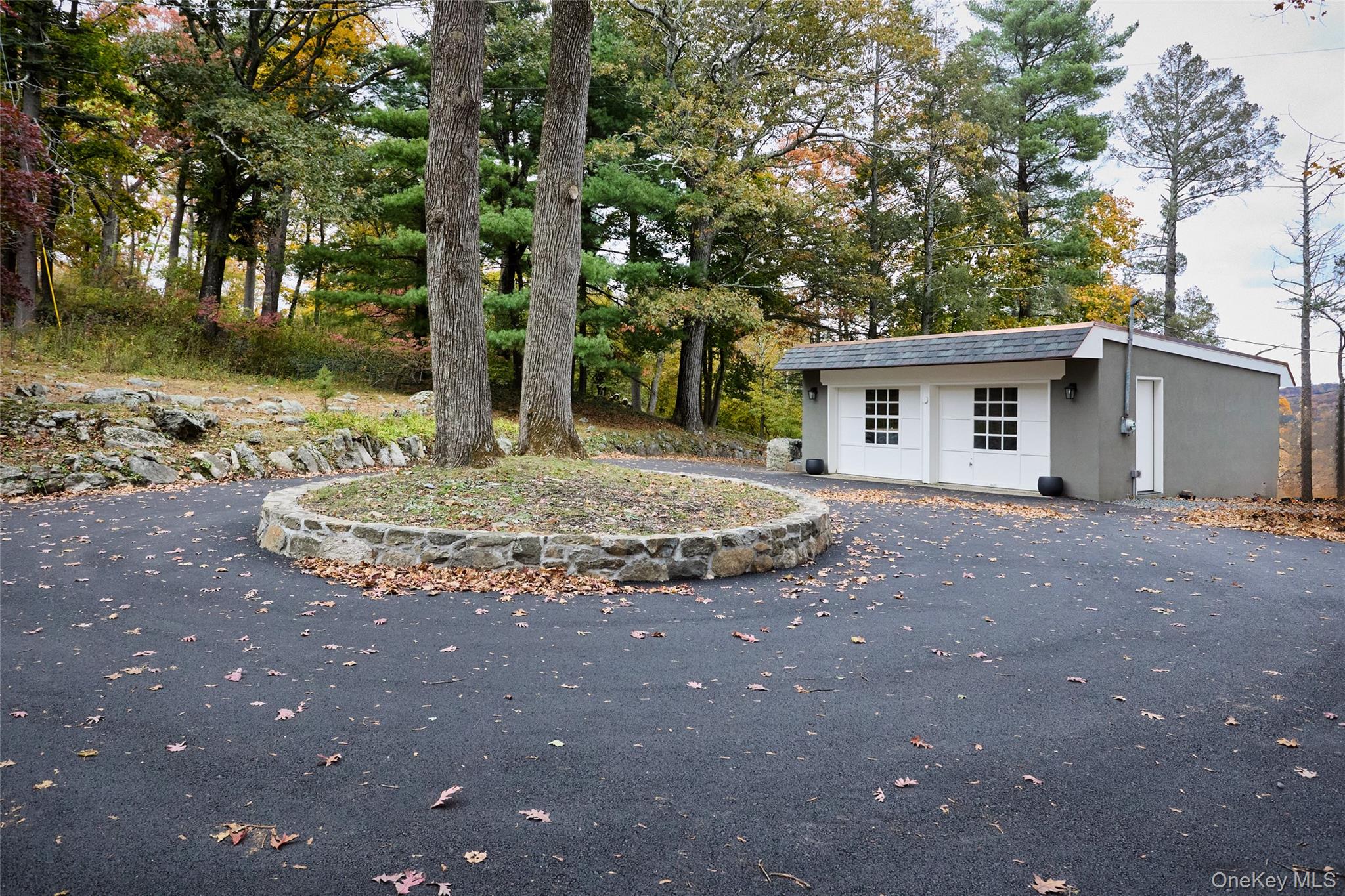 72 Lookout Road Tuxedo Park, NY 10987 - Photo 48 of 49 a view of a house with a tree in the background