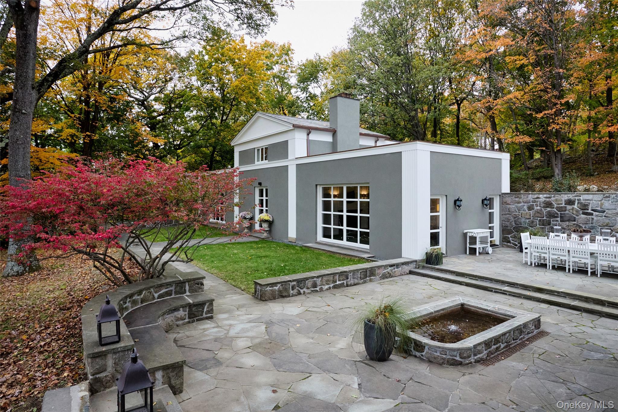 72 Lookout Road Tuxedo Park, NY 10987 - Photo 8 of 49 a view of a backyard with table and chairs