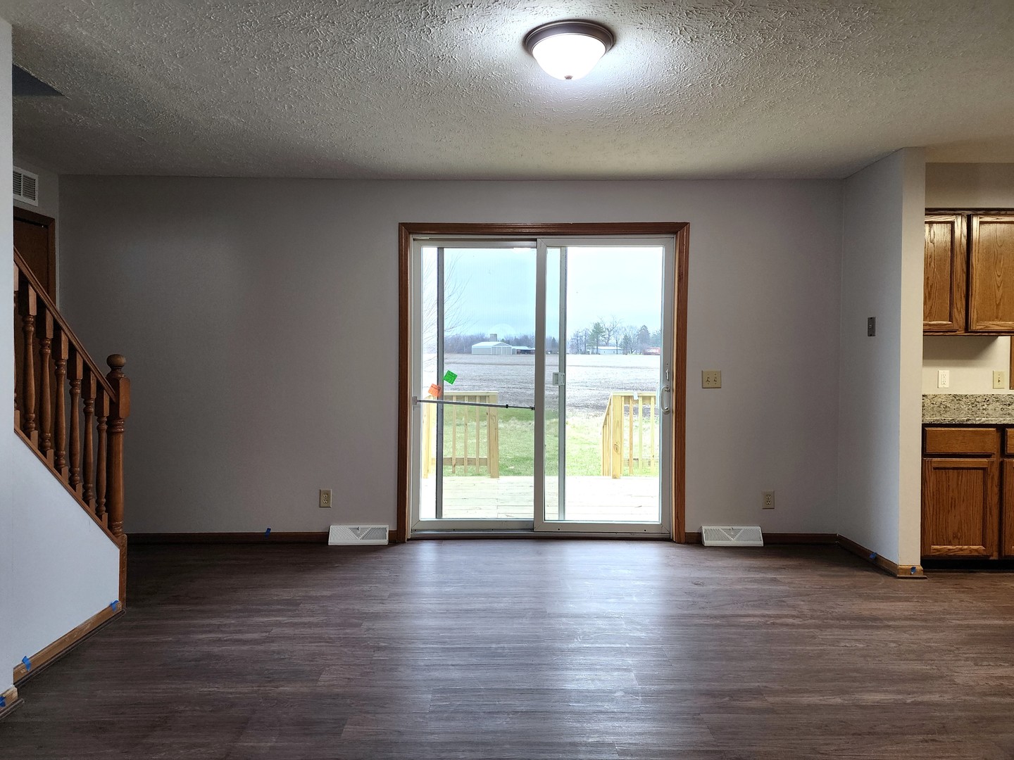 240 Mitchell Court Braidwood, IL 60408 - Photo 4 of 18 a view of an empty room with wooden floor and a window