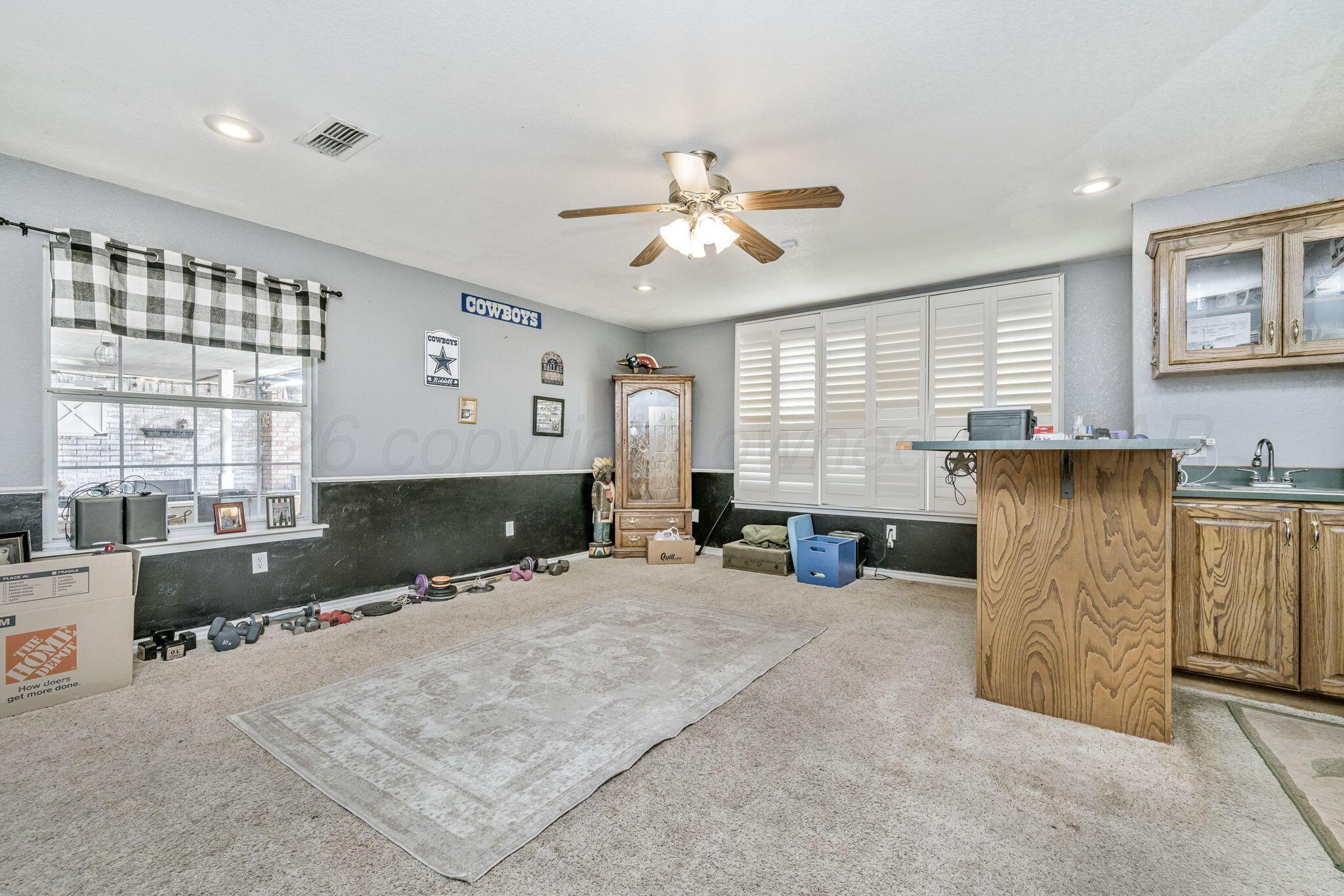 200 Hunters Trail Amarillo, TX 79124 - Photo 10 of 23 a bed room with furniture and a window
