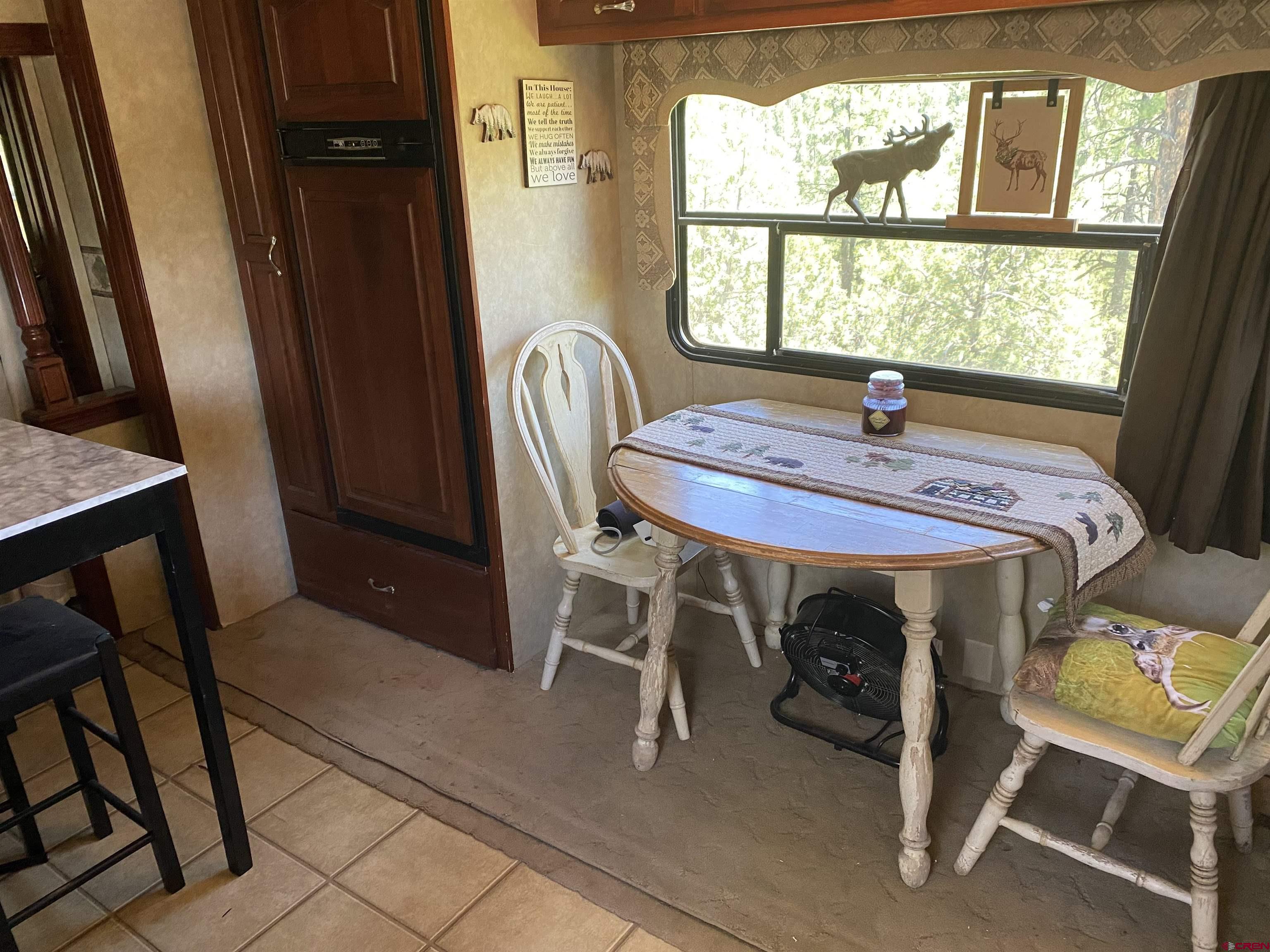2444 Crooked Road Pagosa Springs, CO 81147 - Photo 12 of 22 a dining room with furniture and window