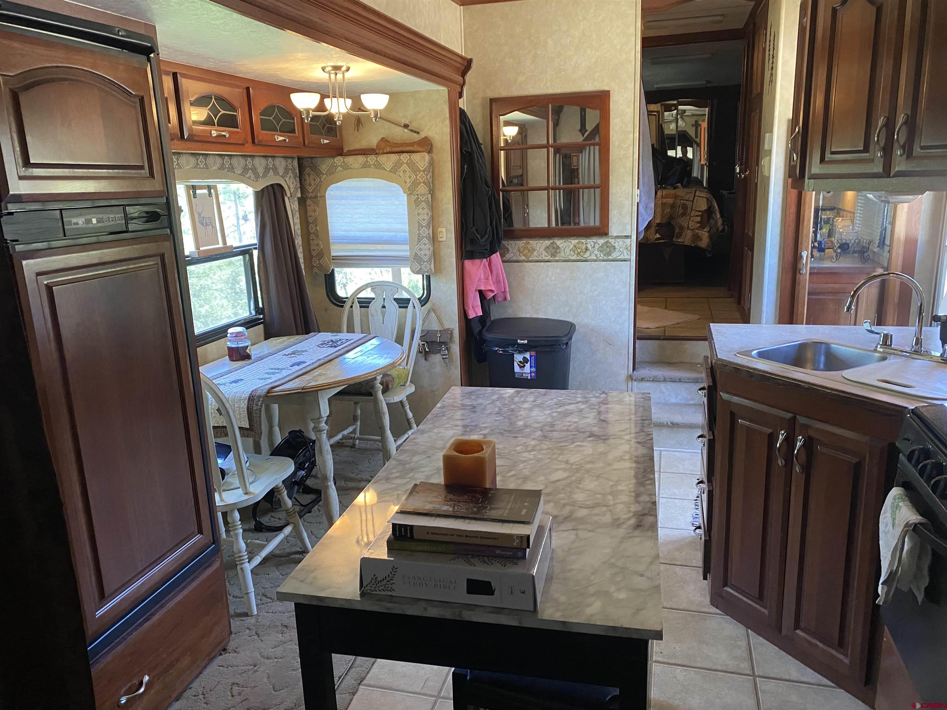 2444 Crooked Road Pagosa Springs, CO 81147 - Photo 14 of 22 a living room with furniture and a fireplace