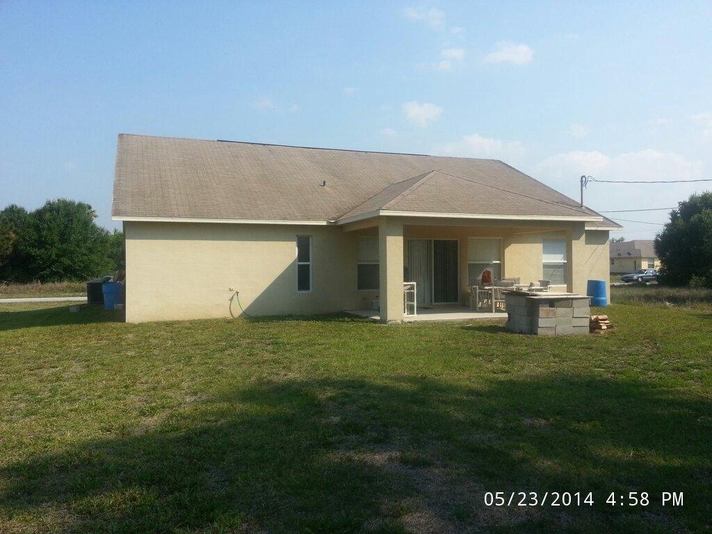 761 Southwest Andrew Road Port St. Lucie, FL 34953 - Photo 3 of 14 Rear Elevation