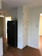 an empty room with wooden floor