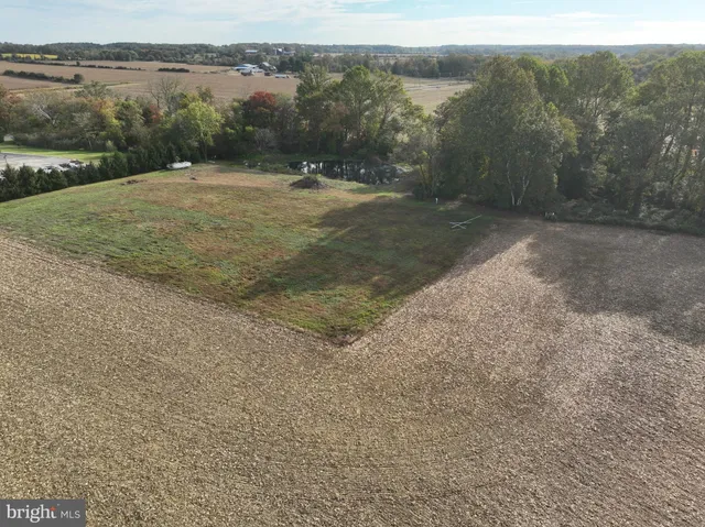 a view of a field with an outdoor space