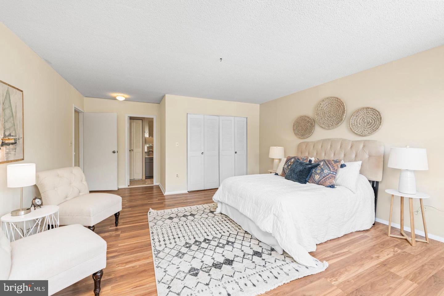 4401 Roland Avenue, Unit 115 Baltimore, MD 21210 - Photo 15 of 25 a bedroom with a bed and a couch