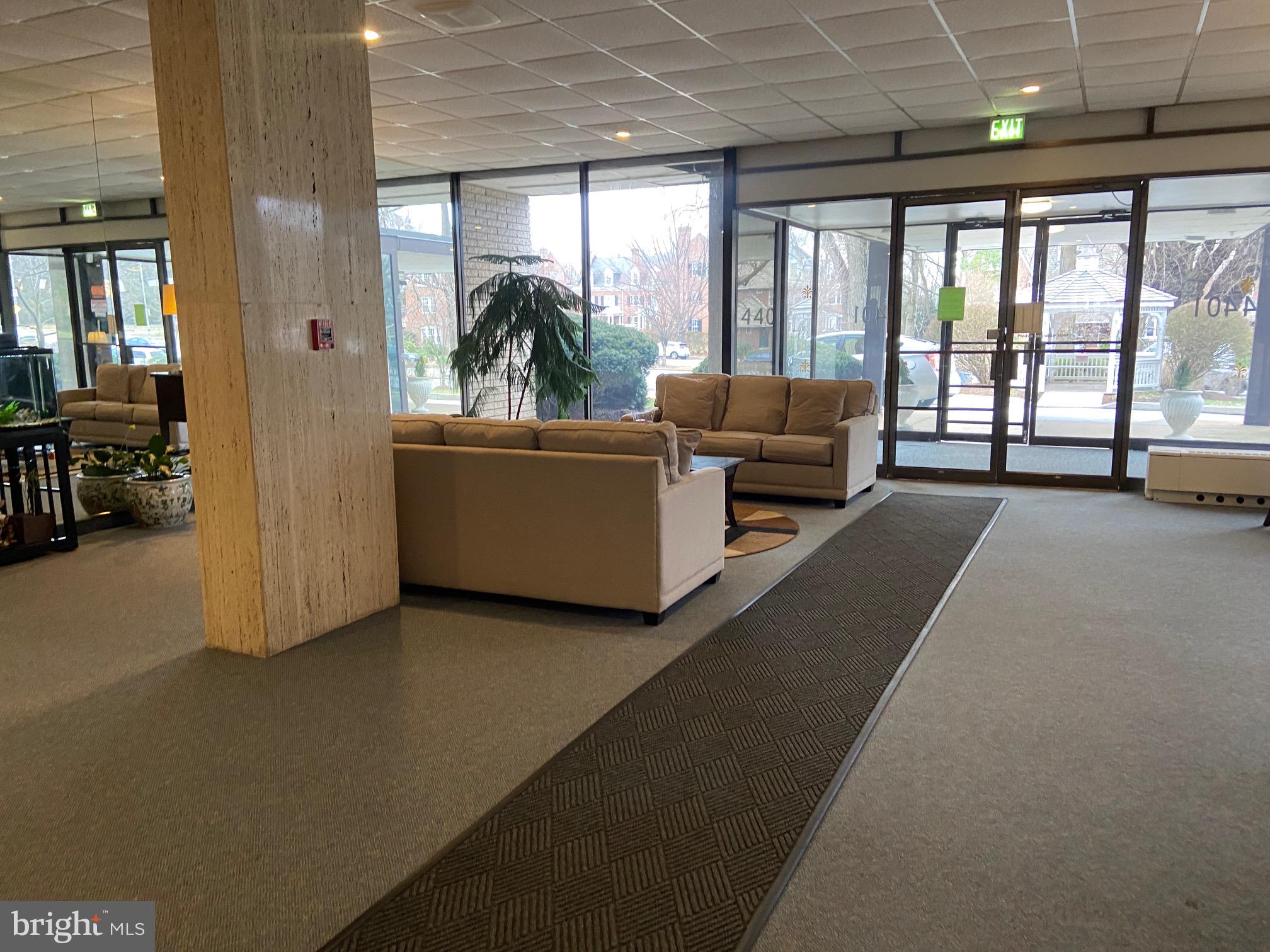 4401 Roland Avenue, Unit 115 Baltimore, MD 21210 - Photo 23 of 25 a living room with furniture and a large window