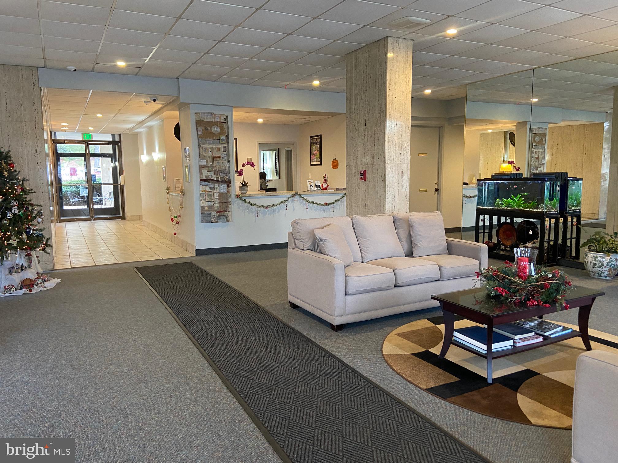 4401 Roland Avenue, Unit 115 Baltimore, MD 21210 - Photo 24 of 25 a living room with furniture and wooden floor