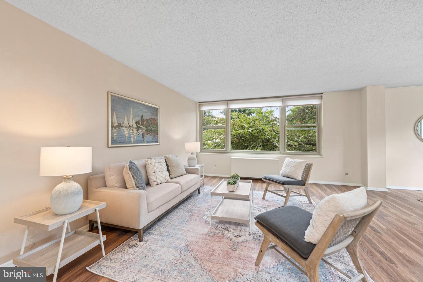 4401 Roland Avenue, Unit 115 Baltimore, MD 21210 - Photo 3 of 25 a living room with furniture and a large window