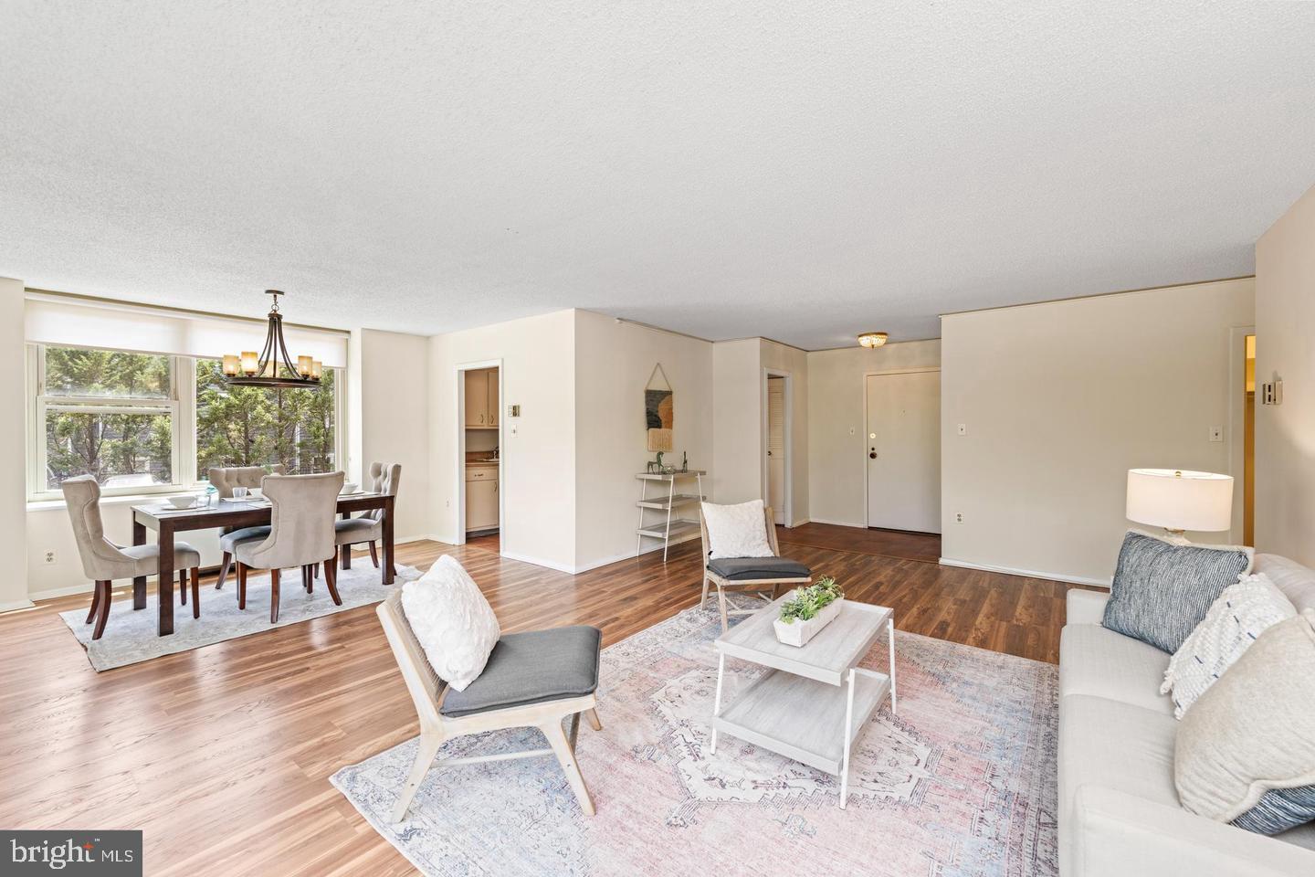 4401 Roland Avenue, Unit 115 Baltimore, MD 21210 - Photo 4 of 25 a living room with furniture and wooden floor