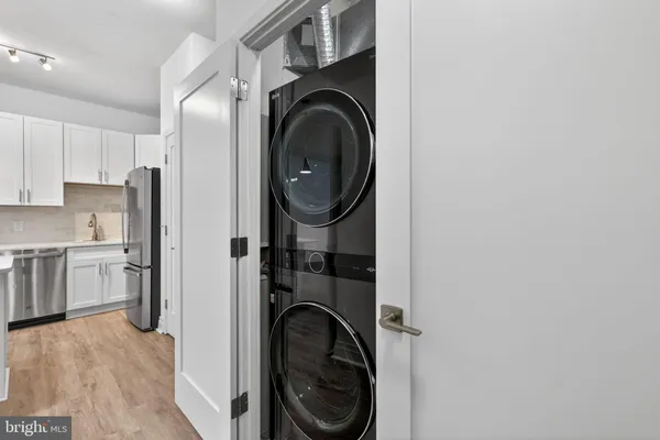 a view of a kitchen with washer and dryer