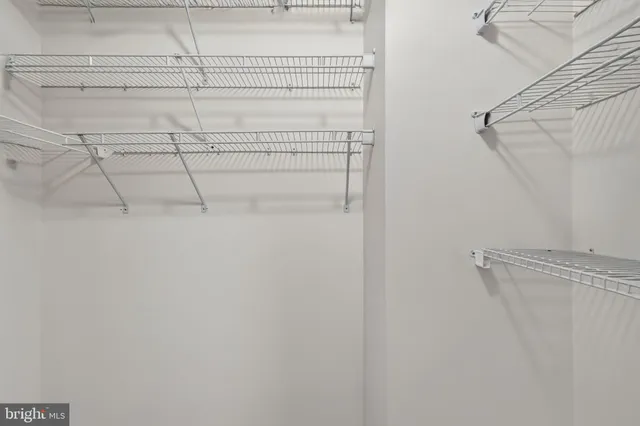 a view of path along with retail shop and buildings