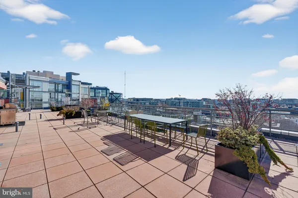 a view of a terrace with furniture and stove