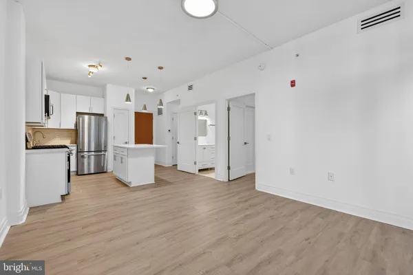 a view of kitchen with wooden floor