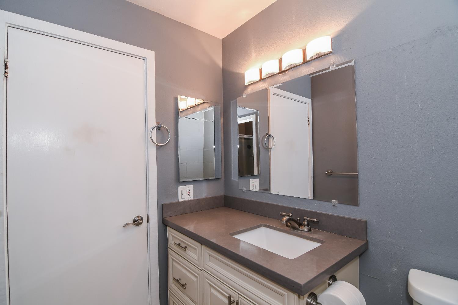 1139 Rivara Circle Sacramento, CA 95864 - Photo 43 of 72 a bathroom with a sink vanity and a mirror
