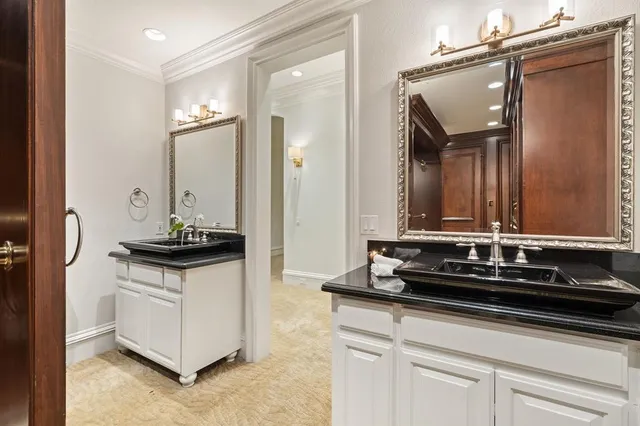 a close view of a sink a counter space and a stove in the kitchen
